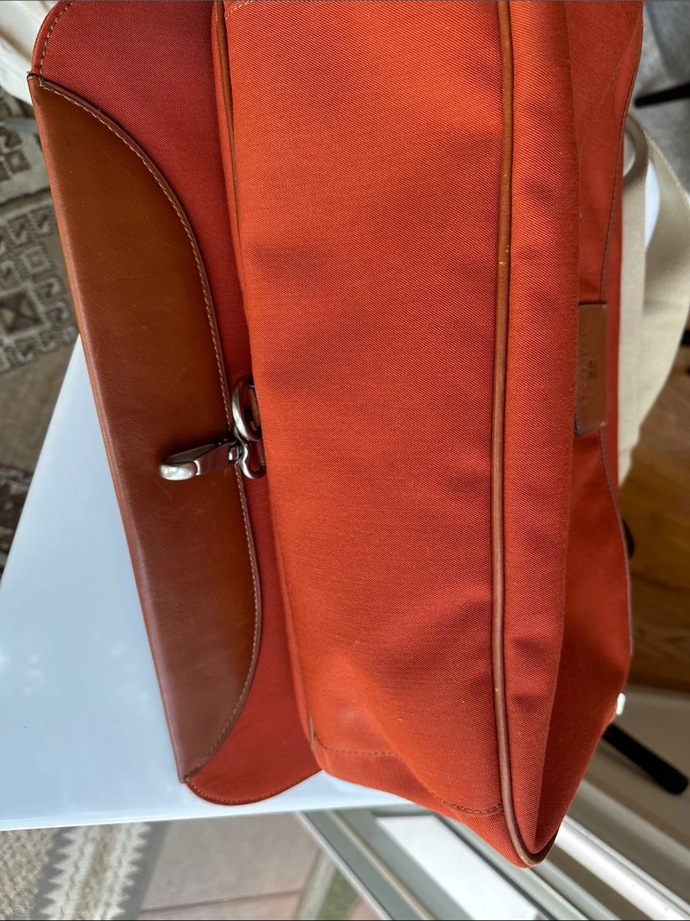 Trafalgar men’s messenger bag burnt orange with leather trim! Live New